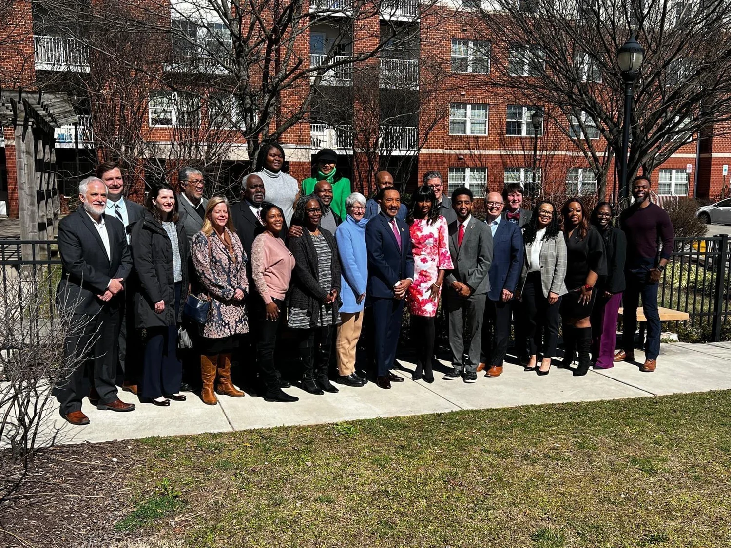 Nicole Earle with community and development partners outdoors